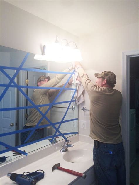 how to remove a large mirror mounted with metal brackets|removing large bathroom mirrors.